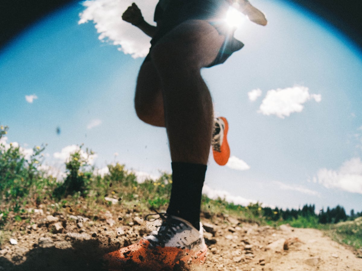 Image capturing dirt kicking up from a trail runner