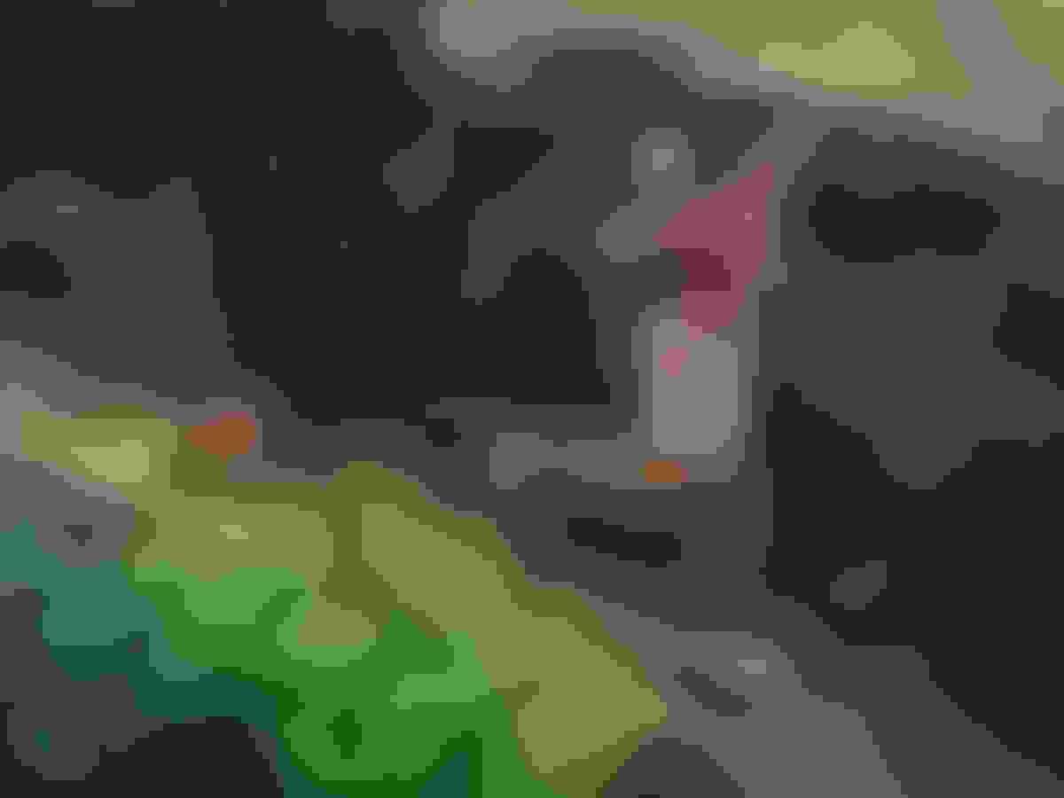 Person running across a green slope